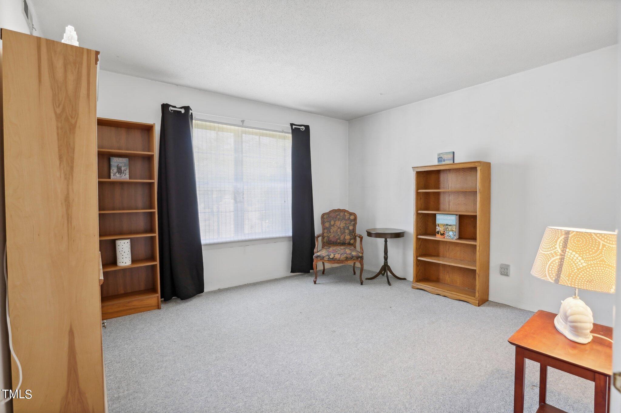 1216 Manassas Court, Unit E Raleigh, NC 27609 - Photo 12 of 20 a view of a livingroom with furniture and staircase