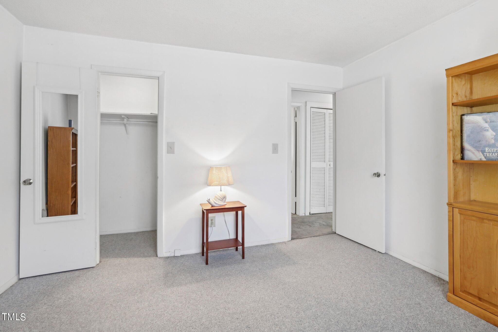 1216 Manassas Court, Unit E Raleigh, NC 27609 - Photo 13 of 20 a view of an empty room and a gallery