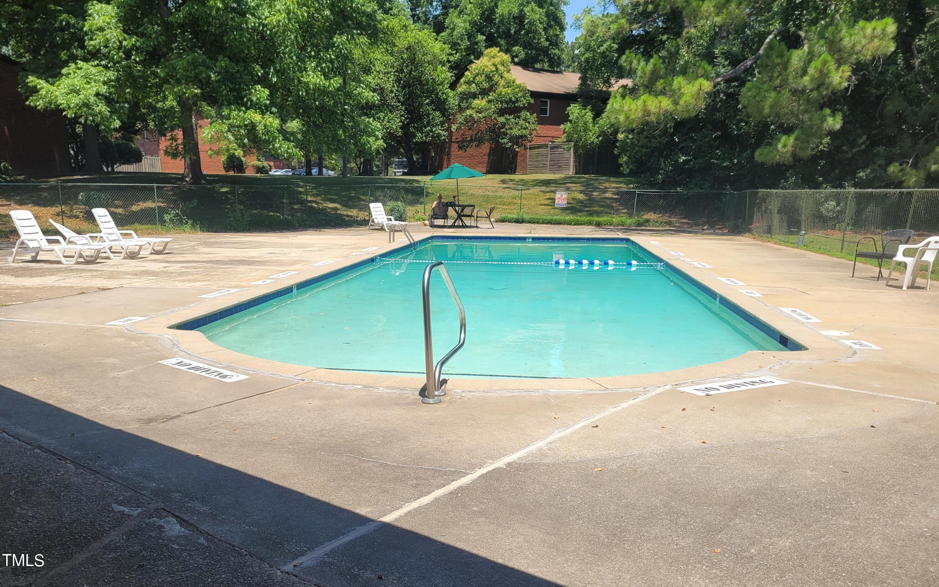 1216 Manassas Court, Unit E Raleigh, NC 27609 - Photo 20 of 20 swimming pool view with a lake view