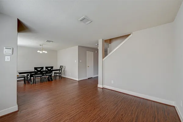 a view of dining room with furniture and wooden floor