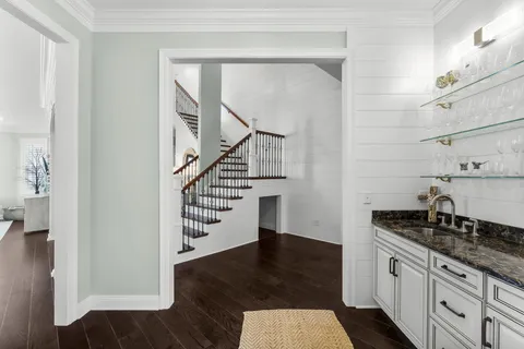 a kitchen with stainless steel appliances granite countertop a stove a sink and a granite counter tops