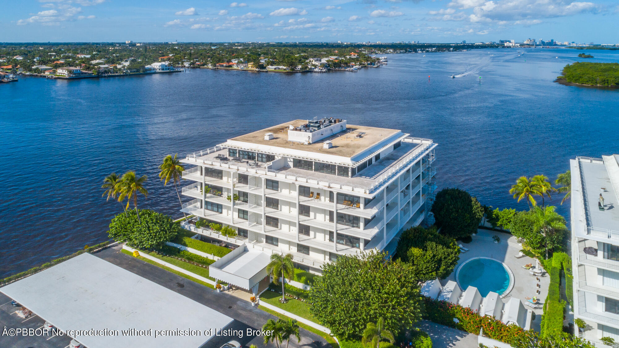 an aerial view of a house with a lake view