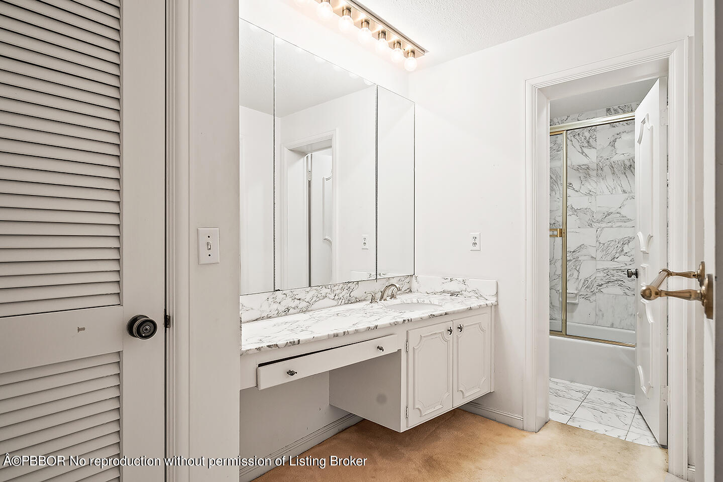 2150 Ibis Isle Road, Unit 17 Palm Beach, FL 33480 - Photo 23 of 55 a bathroom with a double vanity sink a mirror and a shower