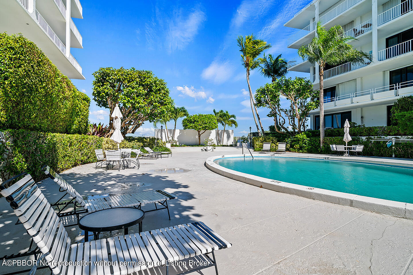 2150 Ibis Isle Road, Unit 17 Palm Beach, FL 33480 - Photo 38 of 55 a view of a swimming pool with a patio