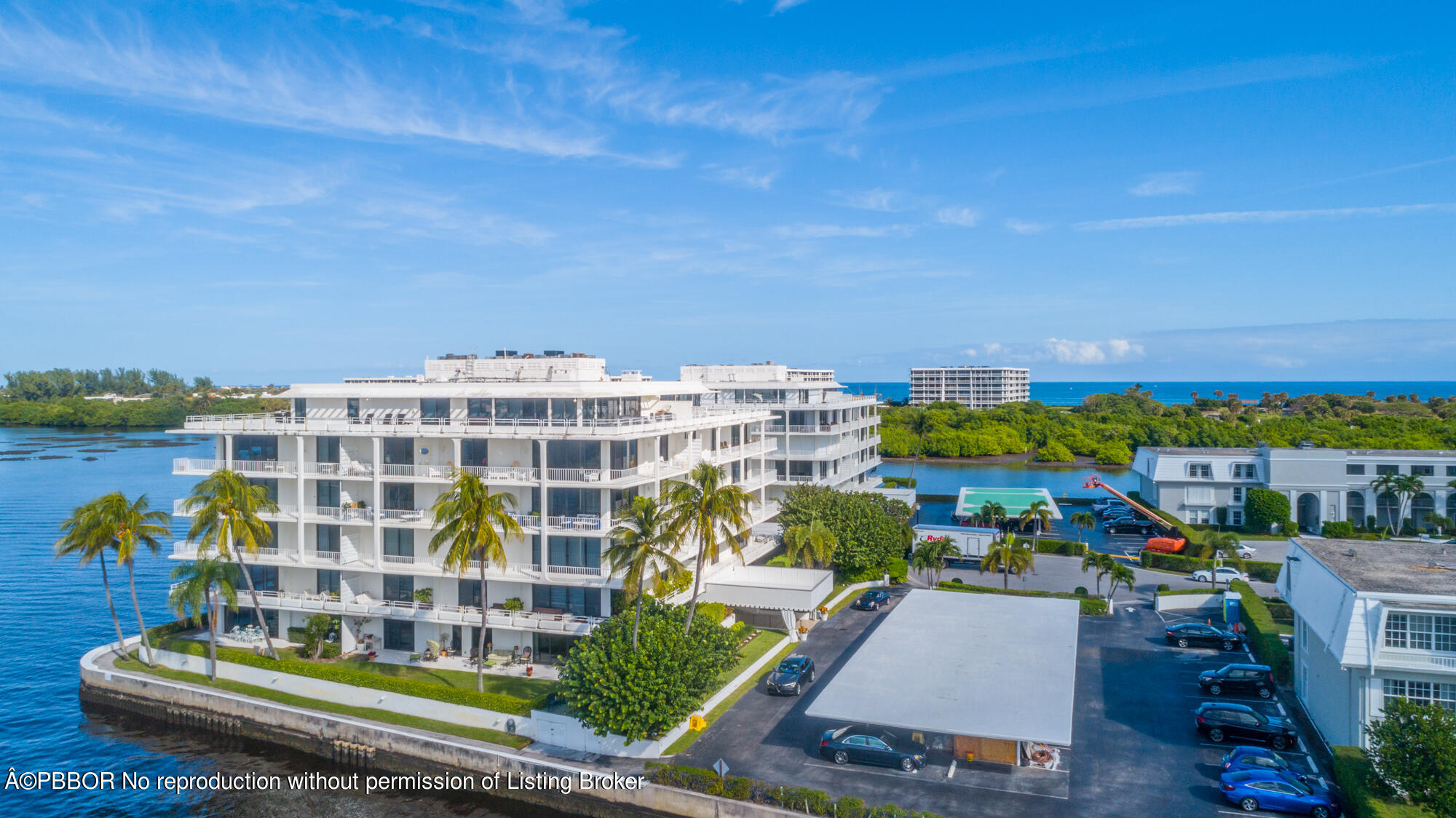 2150 Ibis Isle Road, Unit 17 Palm Beach, FL 33480 - Photo 49 of 55 a view of a swimming pool with outdoor seating and a garden