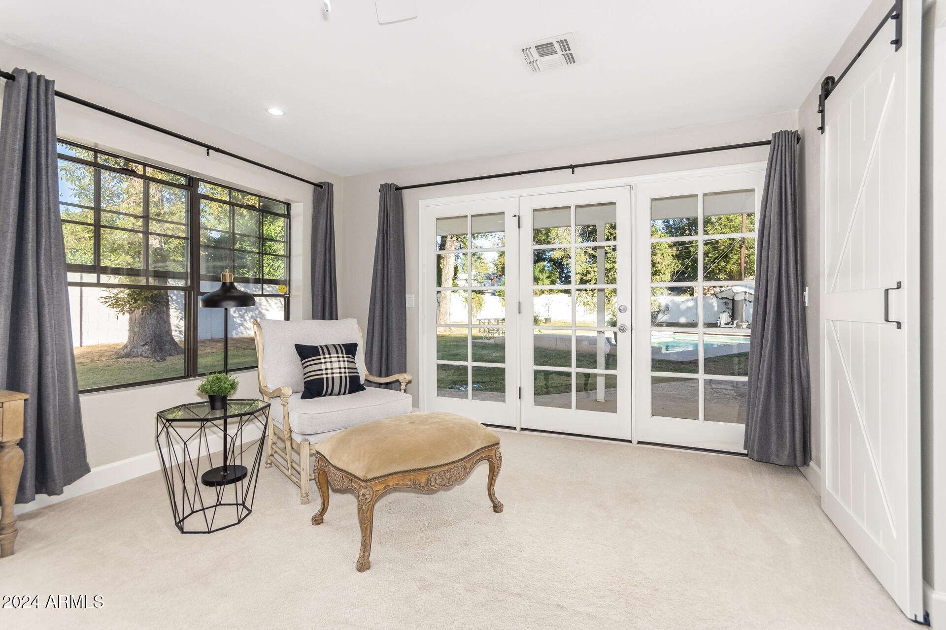 744 West Royal Palm Road Phoenix, AZ 85021 - Photo 18 of 65 a view of a livingroom with furniture wooden floor and a window