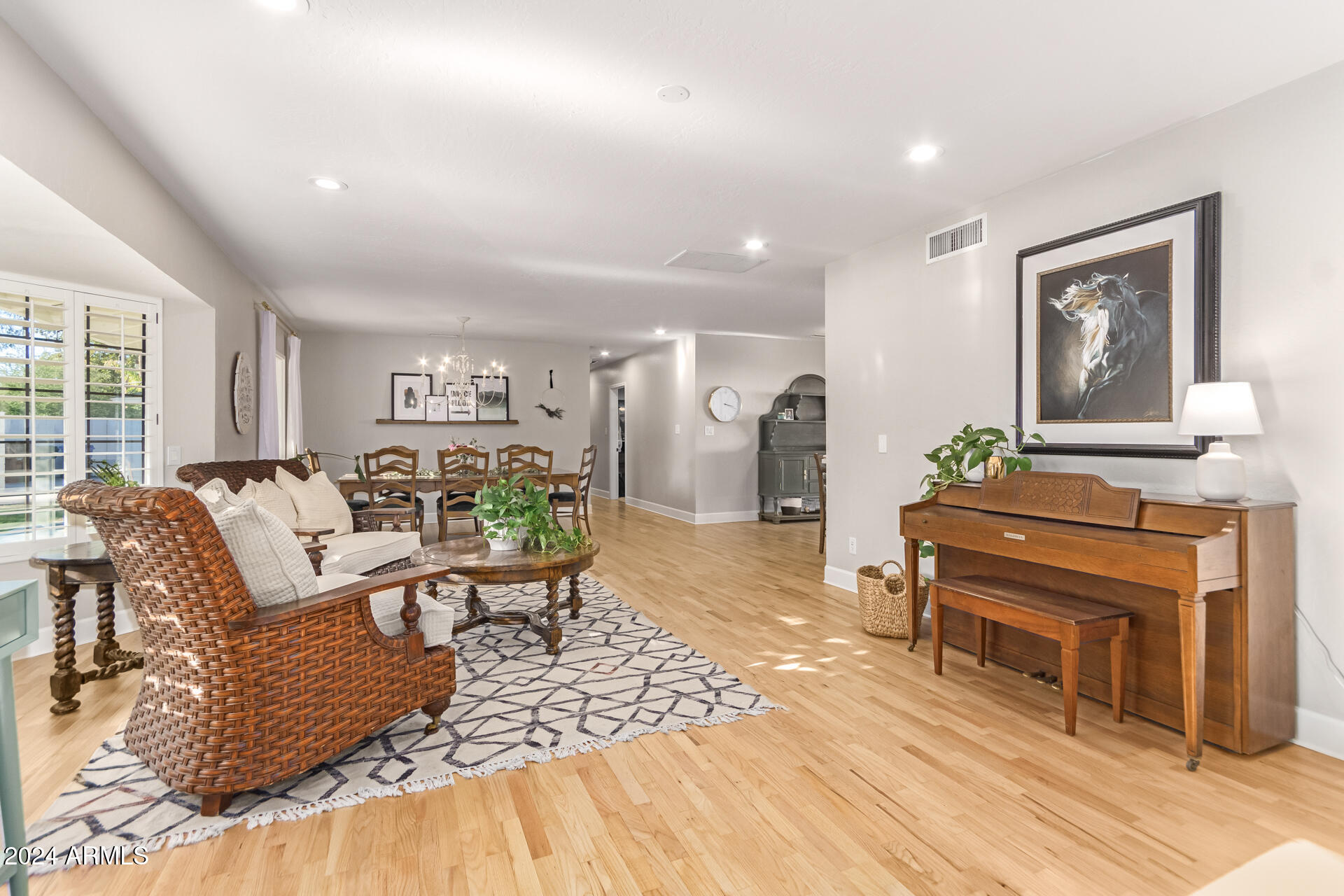 744 West Royal Palm Road Phoenix, AZ 85021 - Photo 4 of 65 a living room with furniture and a wooden floor