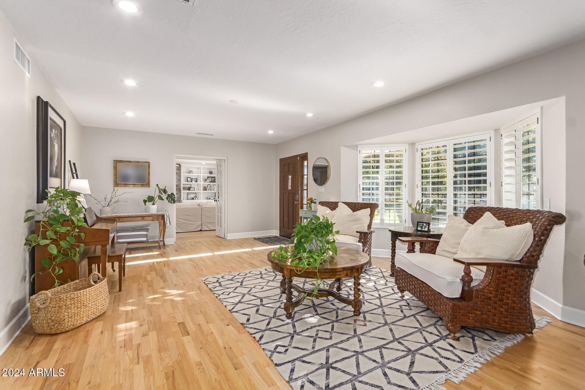 744 West Royal Palm Road Phoenix, AZ 85021 - Photo 6 of 65 a living room with furniture and a potted plant