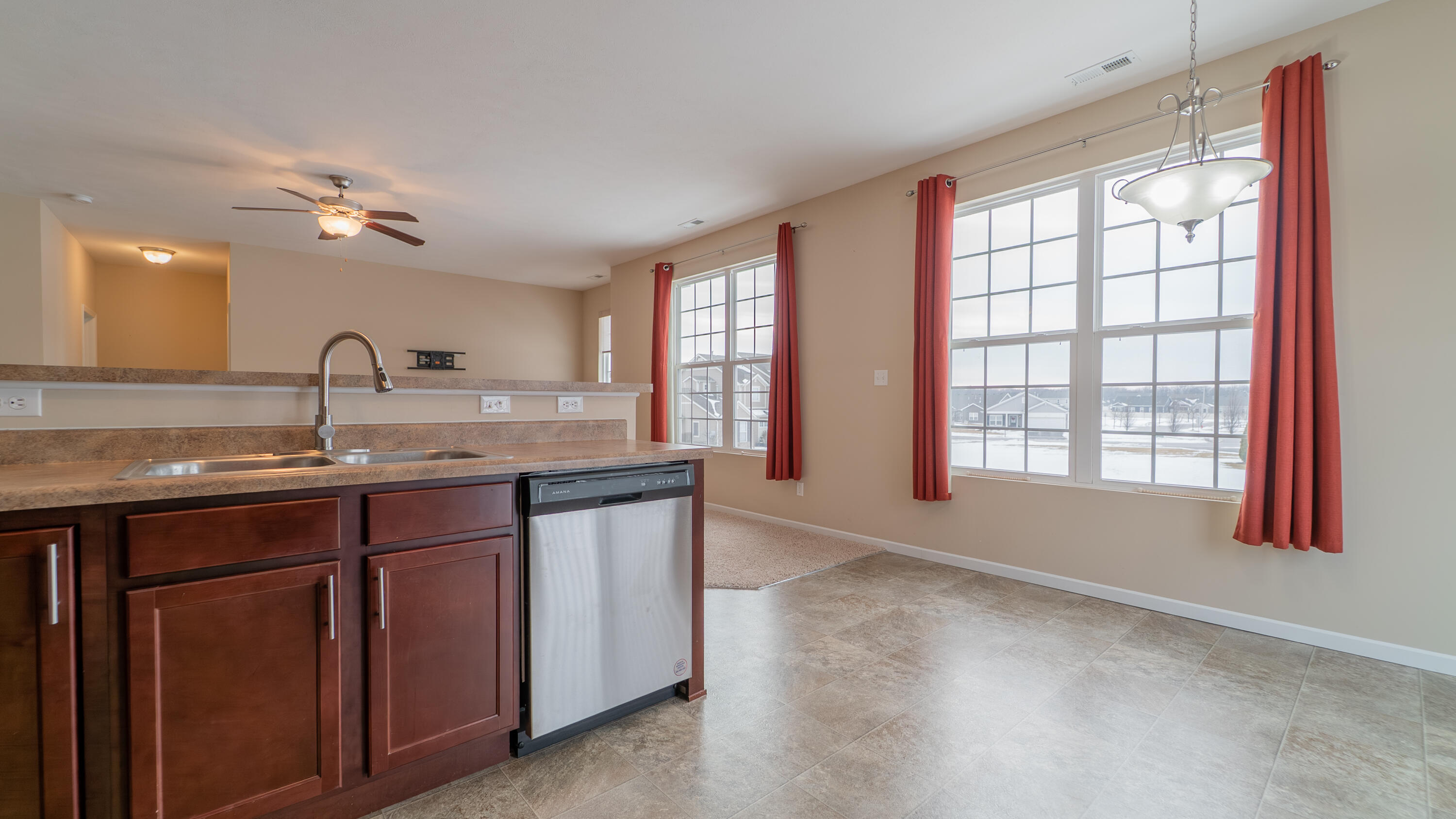 11530 Vermont Court Crown Point, IN 46307 - Photo 12 of 27 a kitchen with a sink and large window