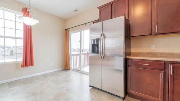 a refrigerator freezer sitting inside of a kitchen
