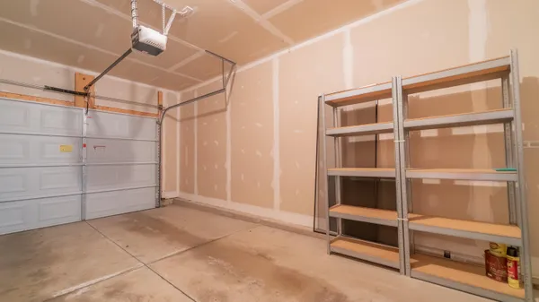 a view of an empty room with empty shelves