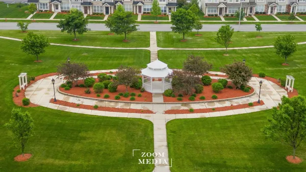 a view of a golf course with a fountain