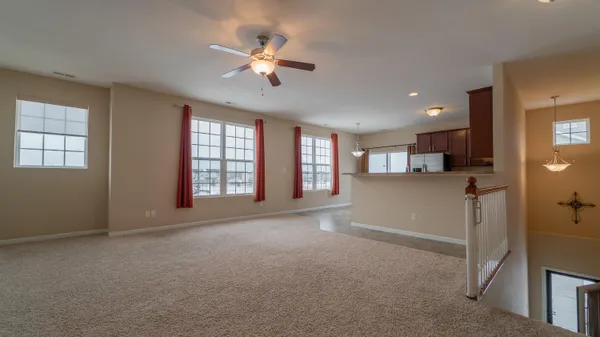 a view of livingroom with hardwood floor and kitchen view