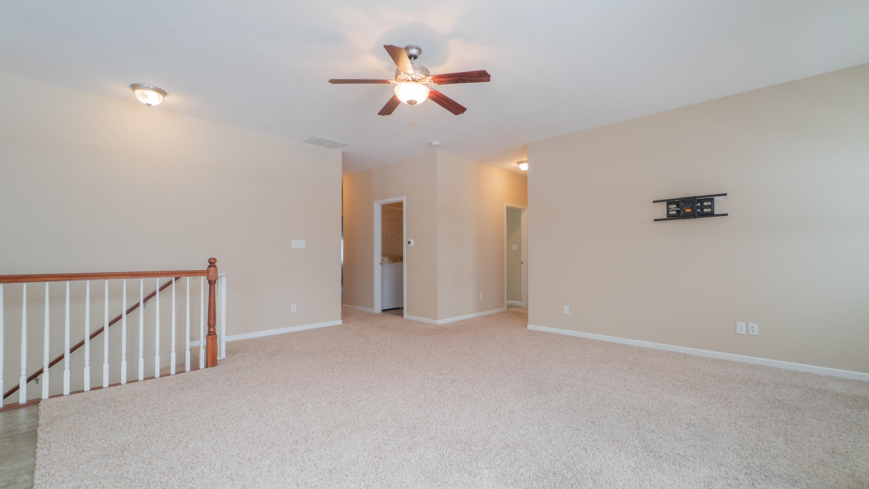 11530 Vermont Court Crown Point, IN 46307 - Photo 7 of 27 a view of an empty room with a ceiling fan
