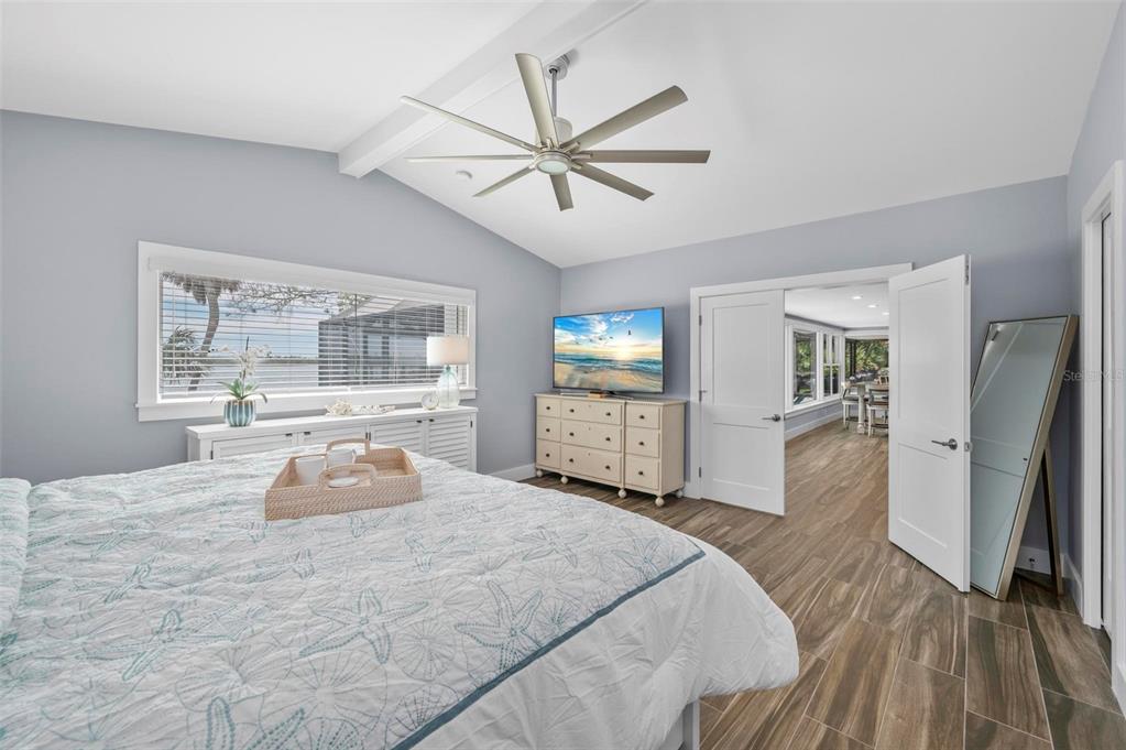 75 Spyglass Alley Placida, FL 33946 - Photo 25 of 79 a bedroom with a large bed and a window