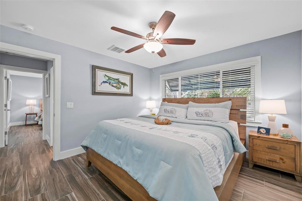 75 Spyglass Alley Placida, FL 33946 - Photo 35 of 79 a bedroom with a large bed and a window