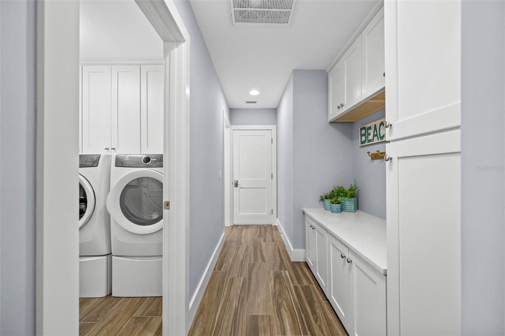75 Spyglass Alley Placida, FL 33946 - Photo 36 of 79 a view of a hallway with washer and dryer