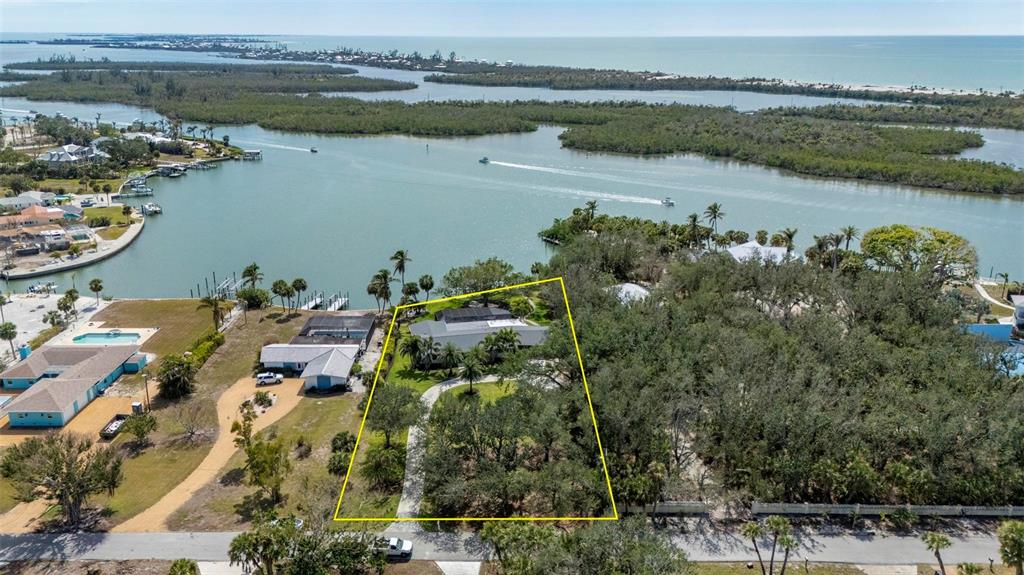 75 Spyglass Alley Placida, FL 33946 - Photo 68 of 79 an aerial view of lake and residential houses with outdoor space