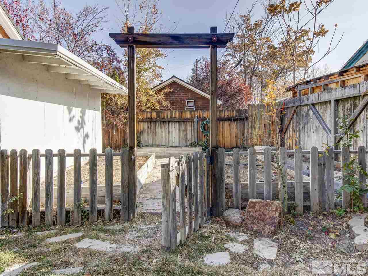 950 Walker Avenue Reno, NV 89509 - Photo 23 of 25 a view of a house with a small yard and wooden fence