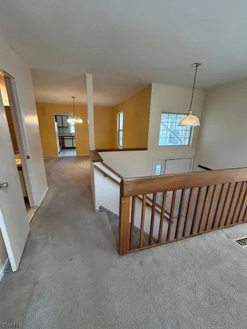 a view of a livingroom with furniture and windows