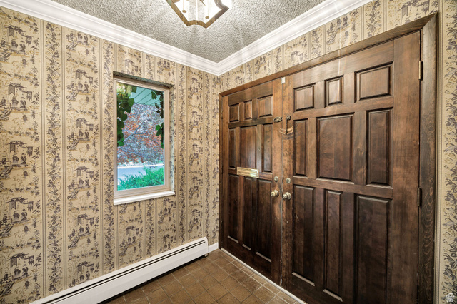 1365 Sumac Drive Logan, UT 84321 - Photo 10 of 66 Double entry doors with panel details, a decorative ceiling fixture, and a single-pane window