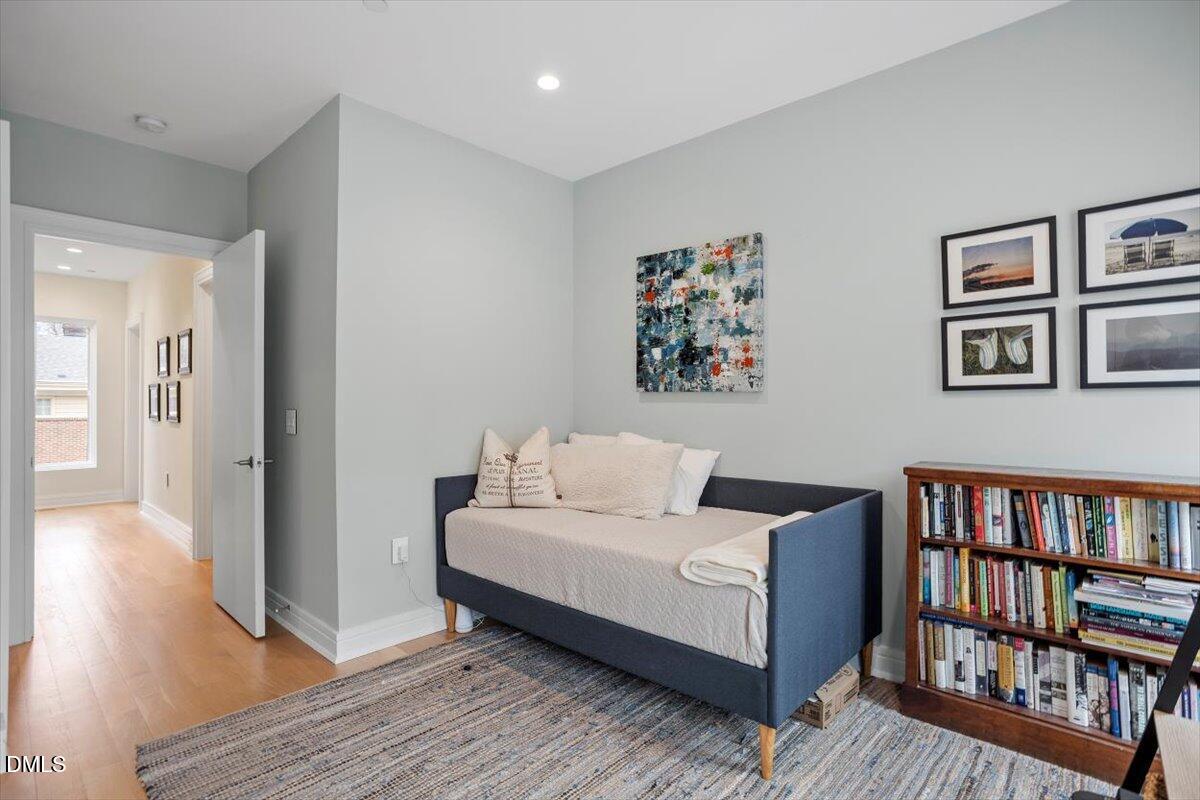 206 Dundas Lane Raleigh, NC 27603 - Photo 22 of 30 a living room with couch and a book shelf