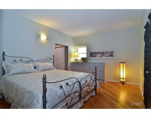 245 Ridge Road Highland Park, IL 60035 - Photo 8 of 10 a bedroom with a bed and wooden floor