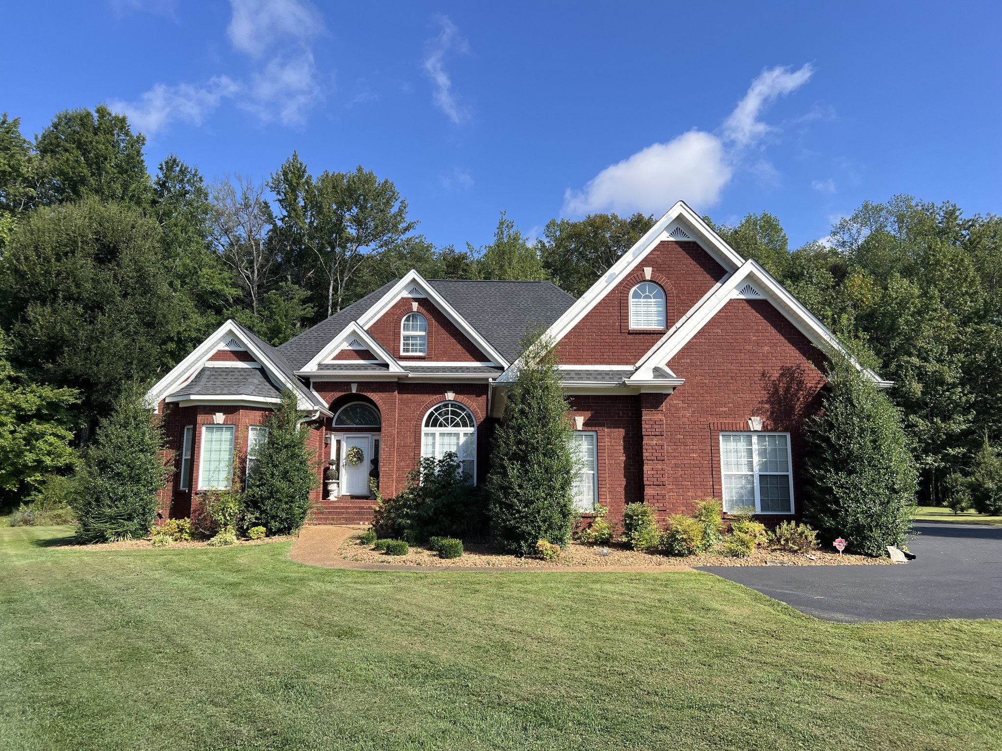 195 Froedge Drive Lafayette, TN 37083 - Photo 1 of 29 a front view of a house with a yard and garage