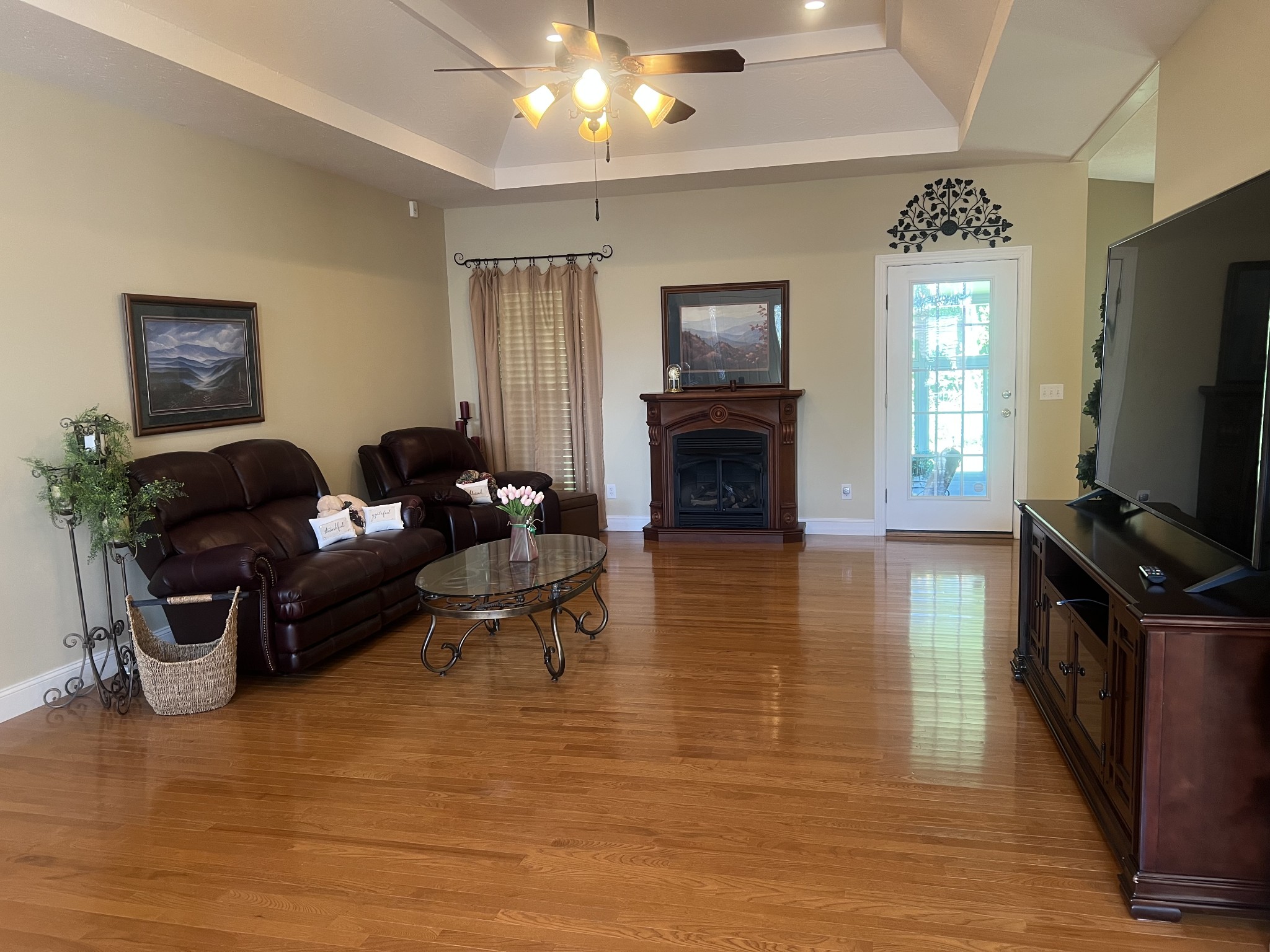 195 Froedge Drive Lafayette, TN 37083 - Photo 3 of 29 a living room with furniture a flat screen tv and a fireplace