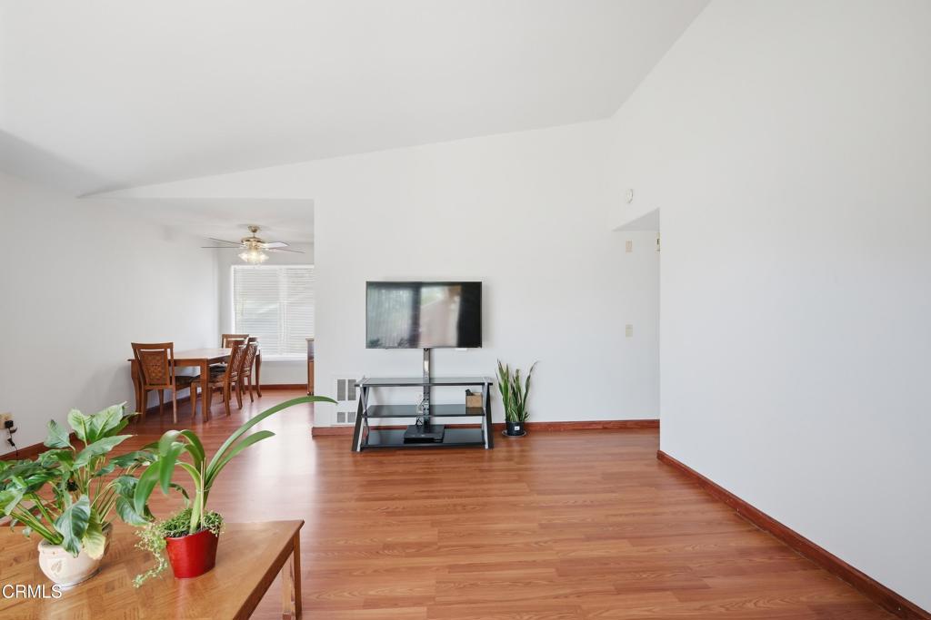 5154 Jefferson Square Oxnard, CA 93033 - Photo 4 of 23 a living room with furniture and a wooden floor