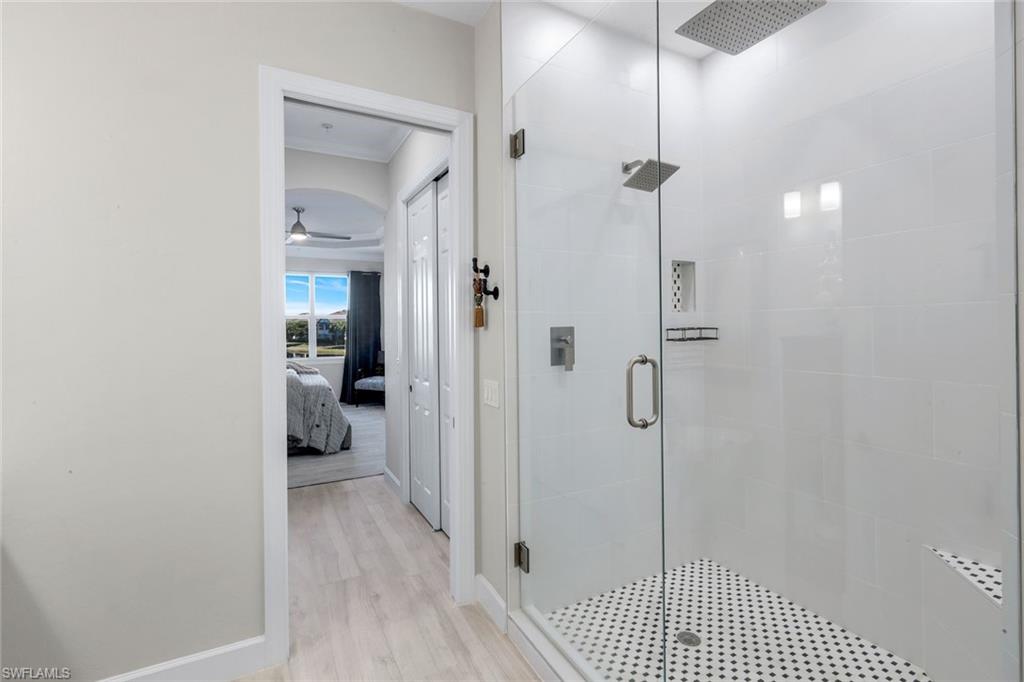 8783 Coastline Court, Unit 202 Naples, FL 34120 - Photo 25 of 49 a view of a bathroom from a hallway