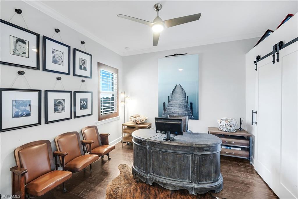 8783 Coastline Court, Unit 202 Naples, FL 34120 - Photo 28 of 49 a living room with furniture and a window