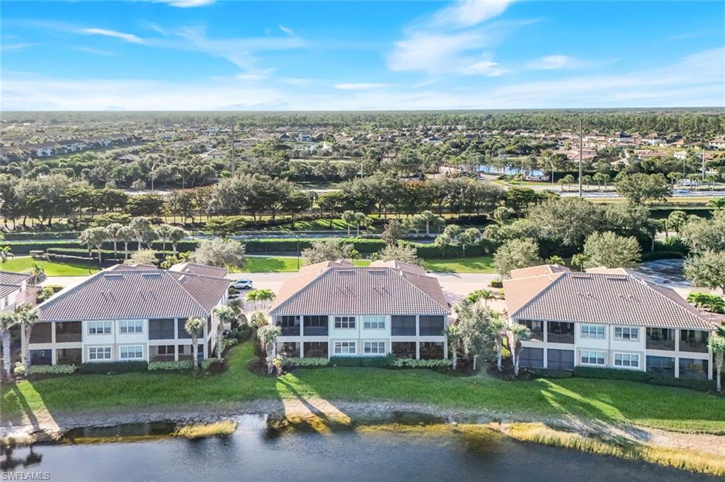 8783 Coastline Court, Unit 202 Naples, FL 34120 - Photo 35 of 49 an aerial view of a house with a garden