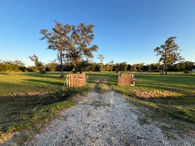 a view of a lake with a yard