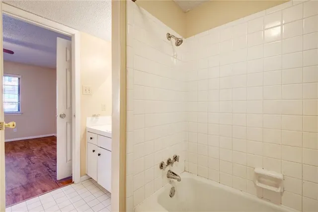 a bathroom with a tub and shower