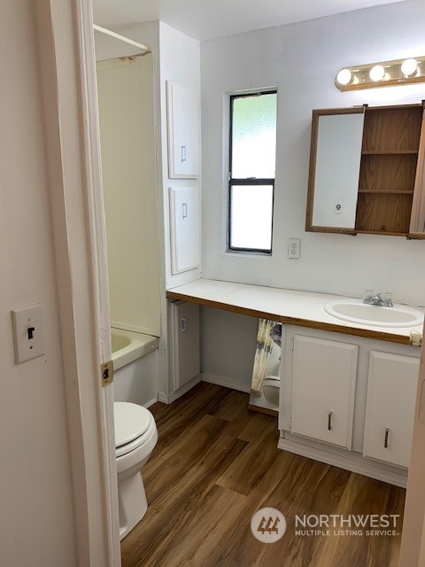 6800 North Enterprise Road, Unit 24 Ferndale, WA 98248 - Photo 16 of 18 a bathroom with a toilet a sink and mirror