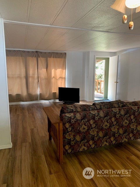 6800 North Enterprise Road, Unit 24 Ferndale, WA 98248 - Photo 4 of 18 a bed sitting in a room next to a window