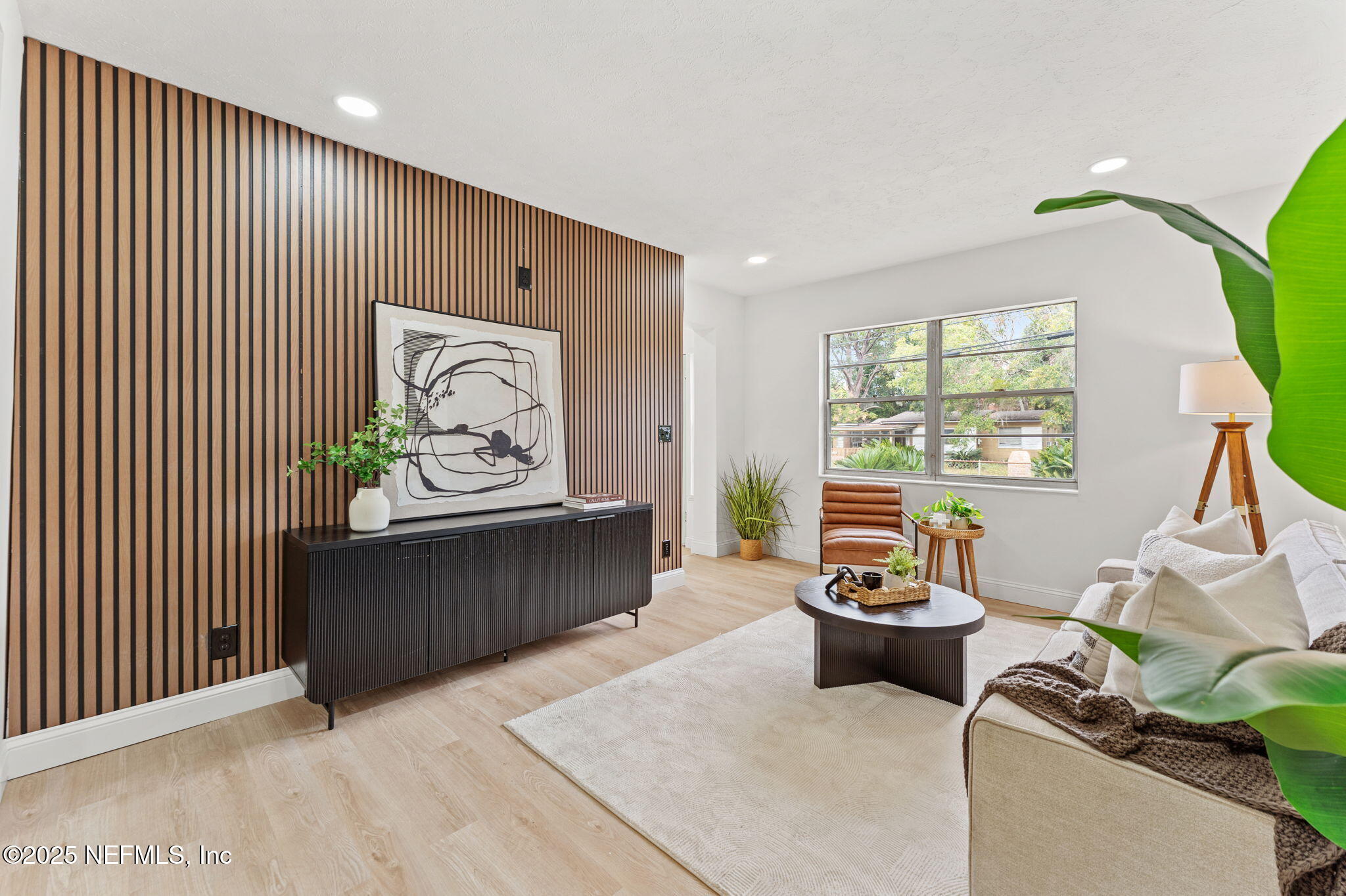 1436 Forest Hills Road Jacksonville, FL 32208 - Photo 14 of 27 a living room with furniture and window