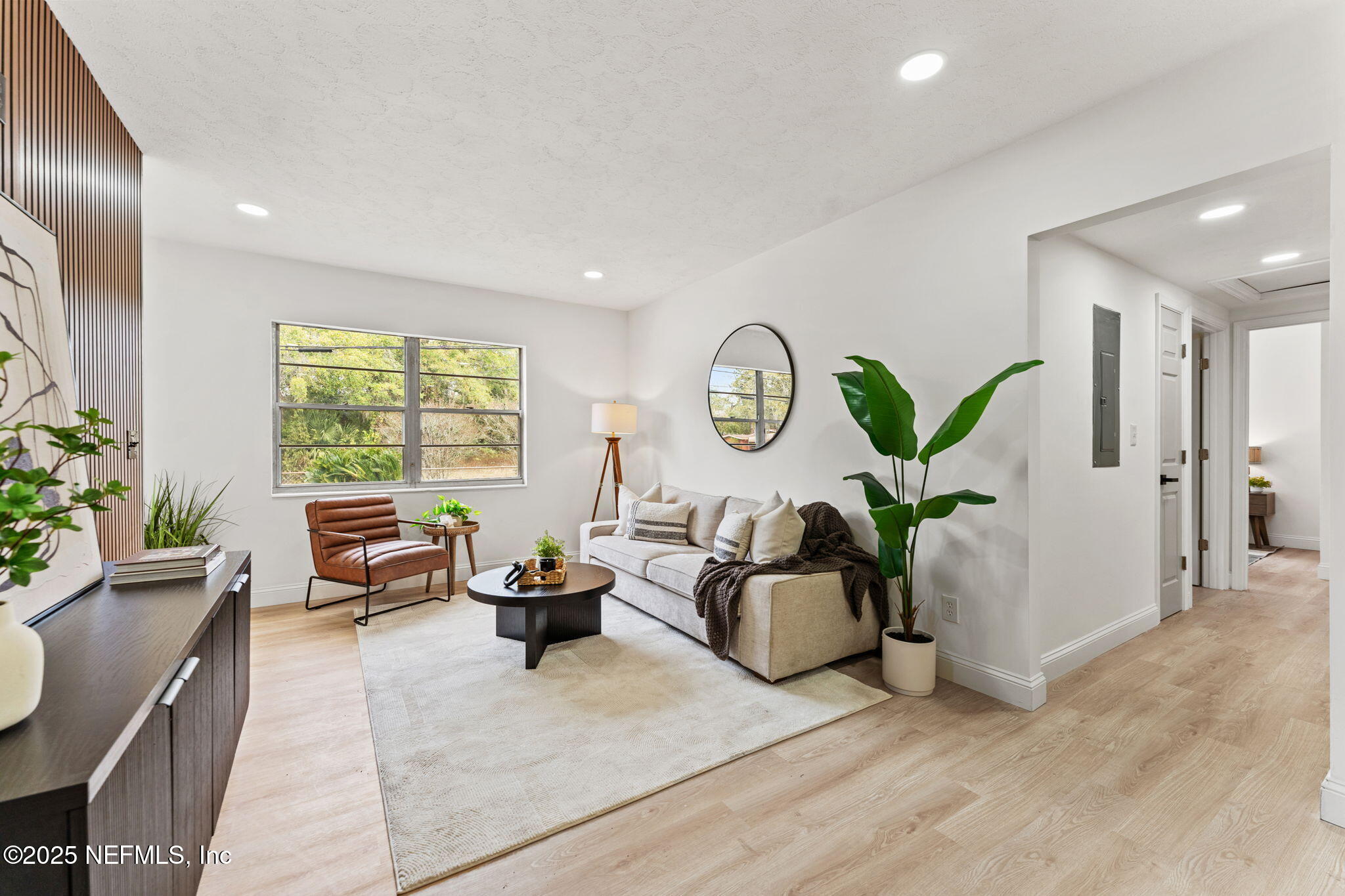 1436 Forest Hills Road Jacksonville, FL 32208 - Photo 15 of 27 a living room with furniture and a window