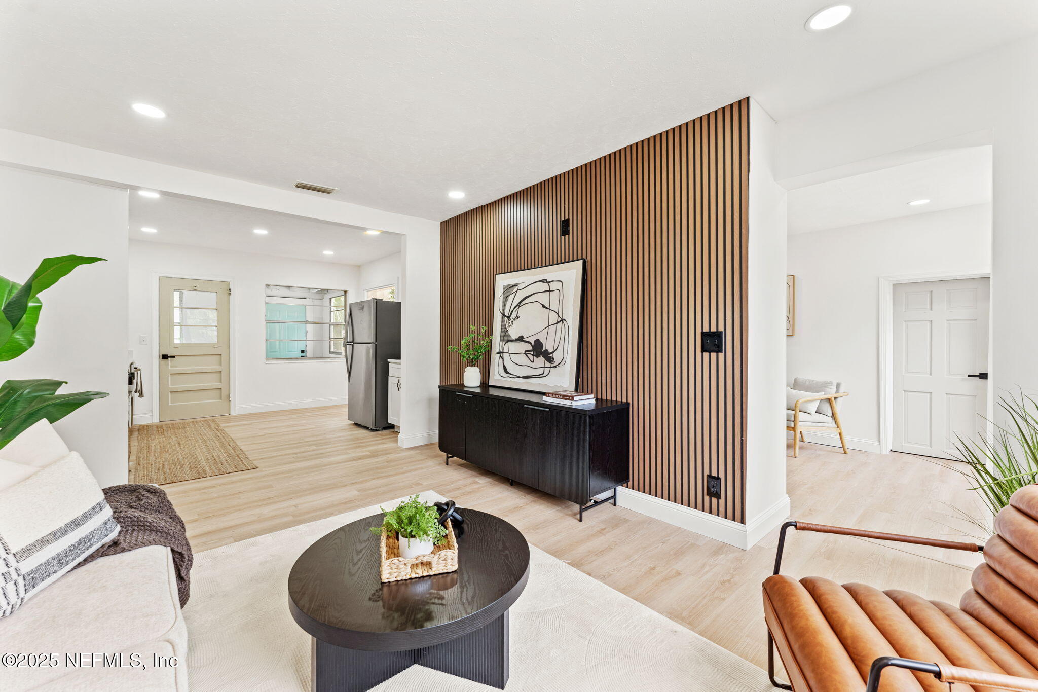 1436 Forest Hills Road Jacksonville, FL 32208 - Photo 16 of 27 a living room with furniture and a table