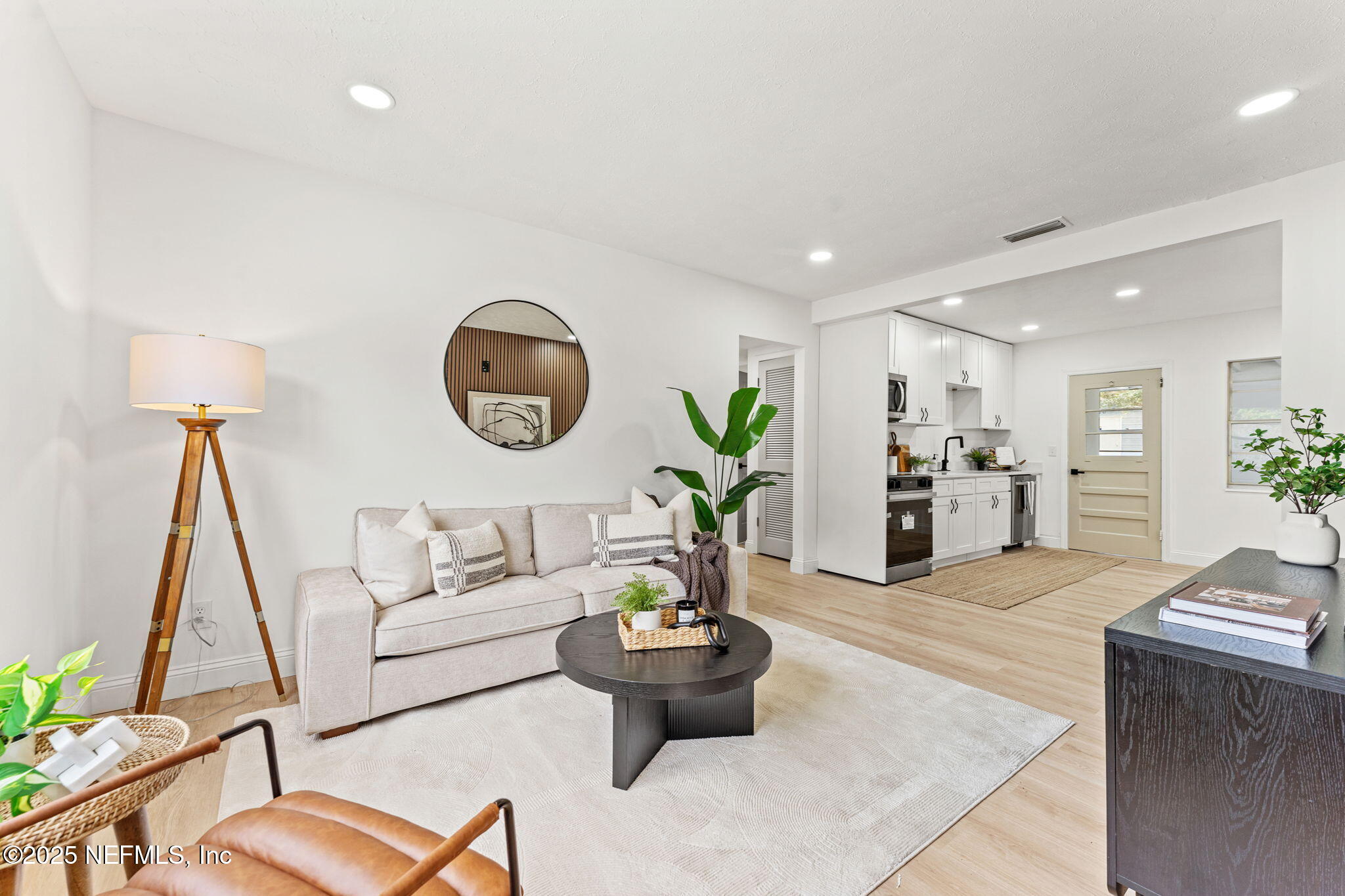 1436 Forest Hills Road Jacksonville, FL 32208 - Photo 17 of 27 a living room with furniture and a large window