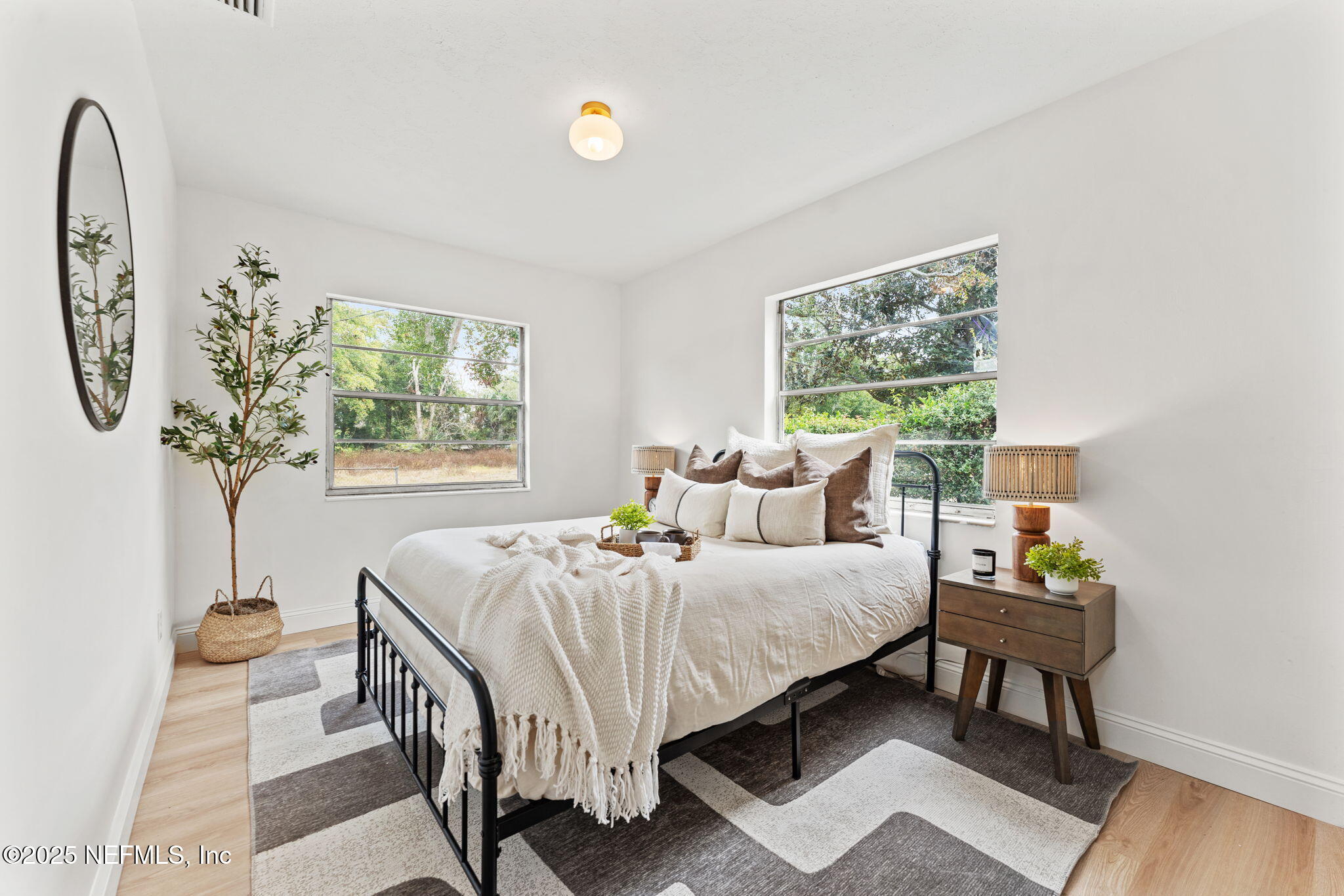 1436 Forest Hills Road Jacksonville, FL 32208 - Photo 20 of 27 a bedroom with a bed and a window