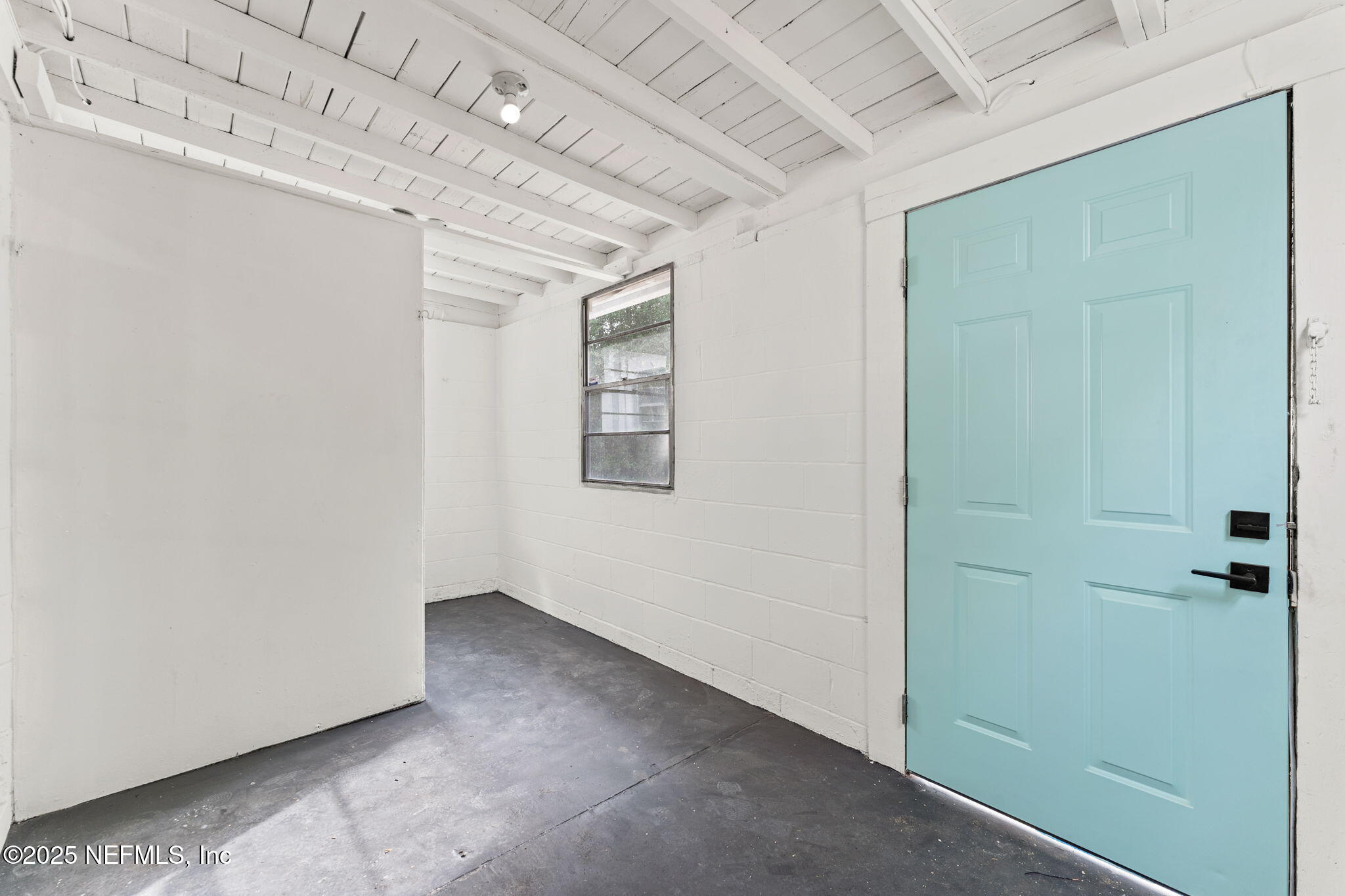 1436 Forest Hills Road Jacksonville, FL 32208 - Photo 22 of 27 an empty room with windows