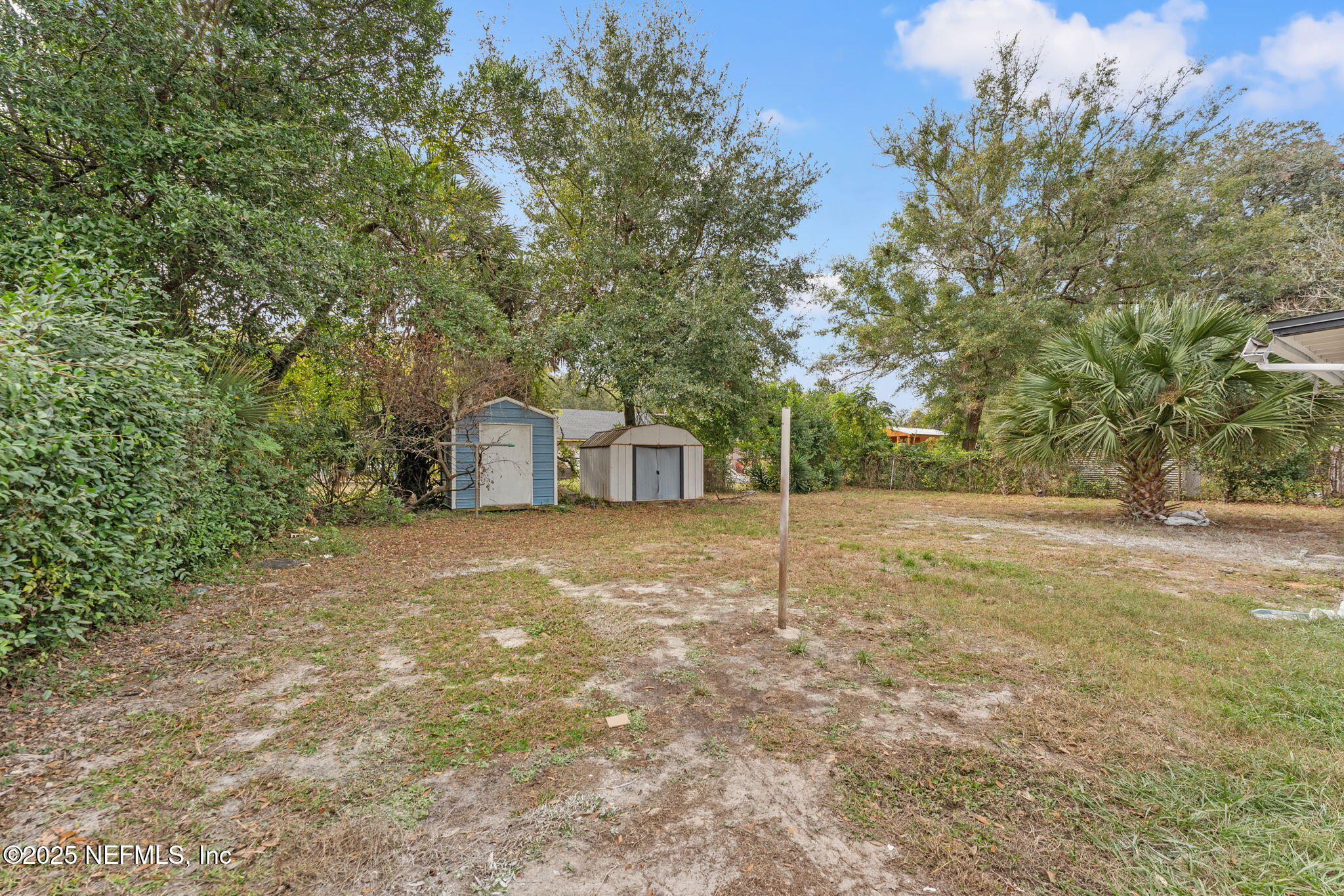 1436 Forest Hills Road Jacksonville, FL 32208 - Photo 27 of 27 a backyard of a house with a trees and barn