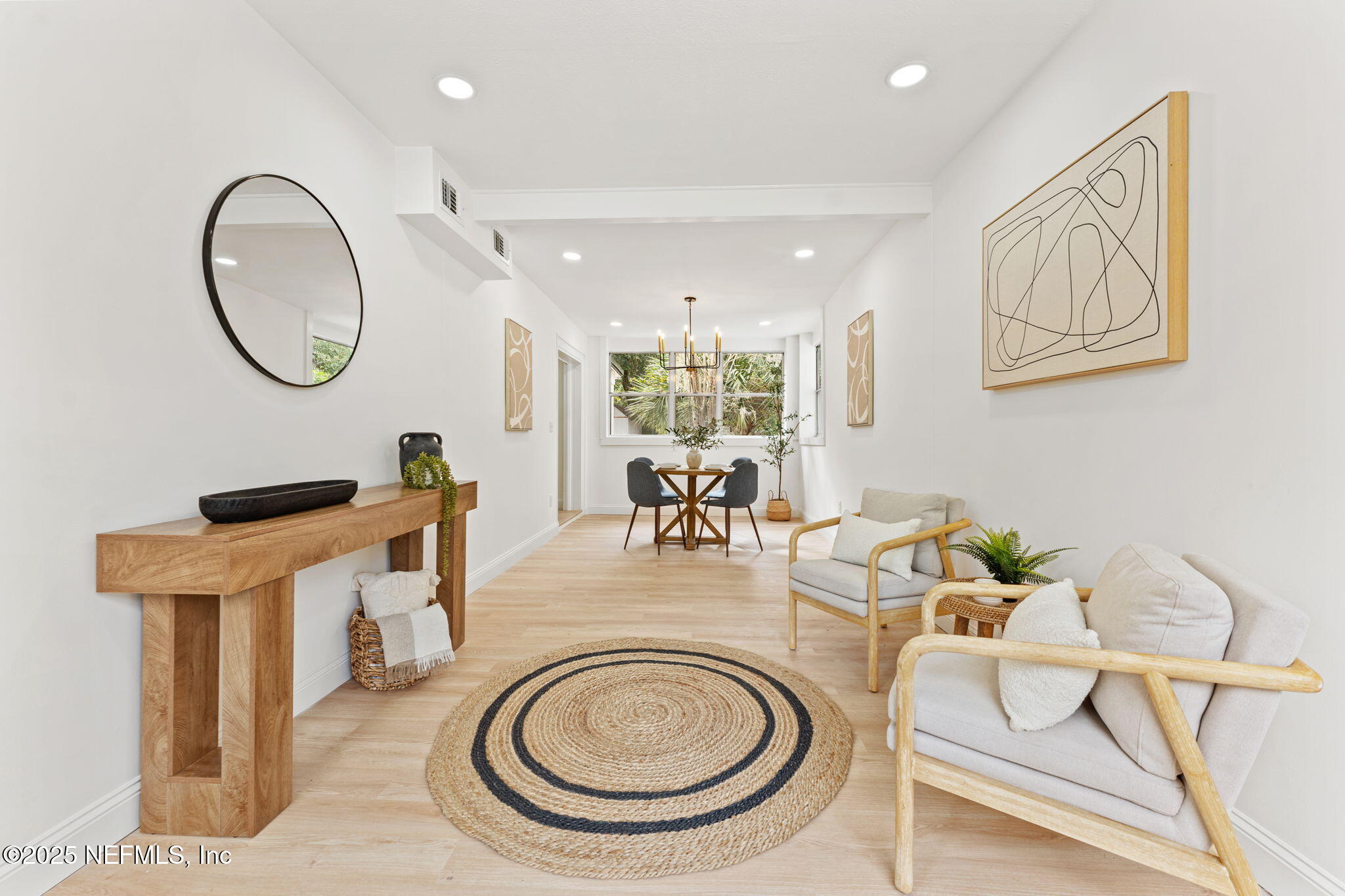 1436 Forest Hills Road Jacksonville, FL 32208 - Photo 4 of 27 a living room with furniture a mirror and a clock