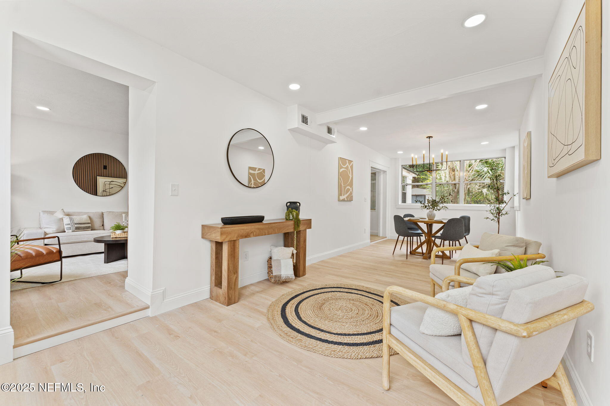1436 Forest Hills Road Jacksonville, FL 32208 - Photo 5 of 27 a living room with furniture a clock and a large window