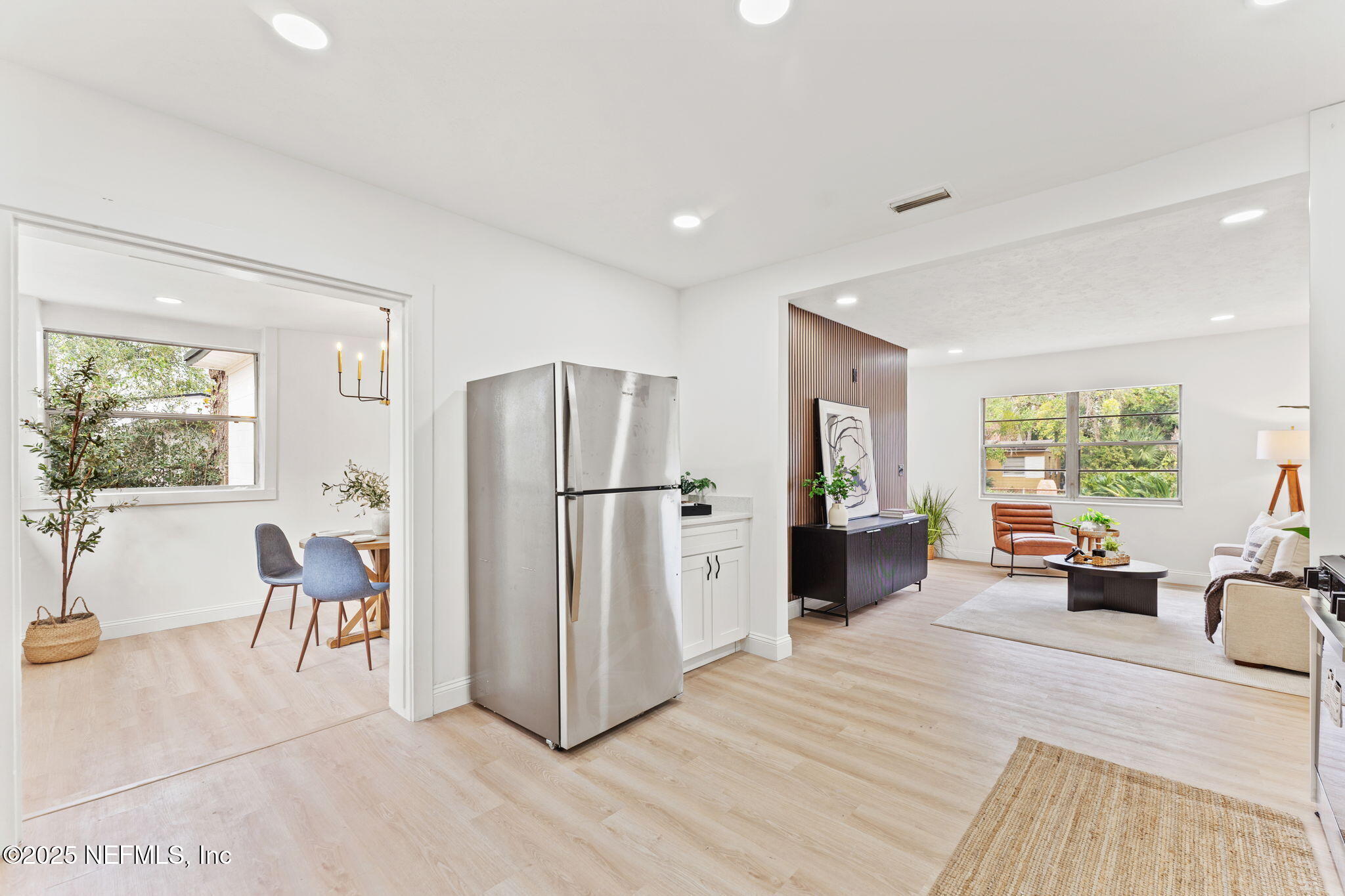 1436 Forest Hills Road Jacksonville, FL 32208 - Photo 10 of 27 a living room with furniture and a refrigerator