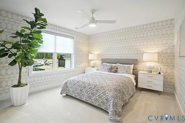 a bedroom with bed and a potted plant