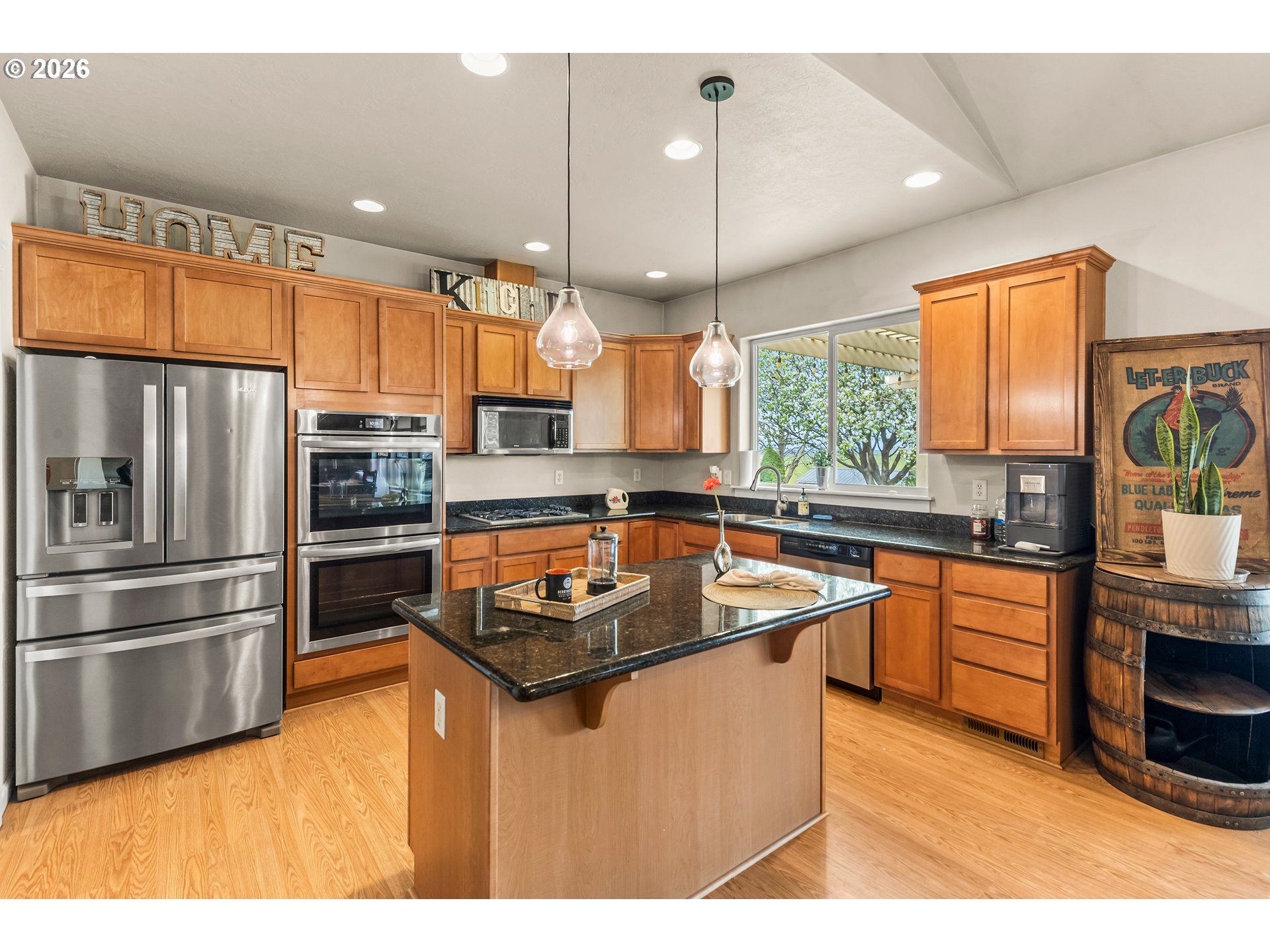 77286 Joyce Way Echo, OR 97826 - Photo 11 of 41 a kitchen with stainless steel appliances granite countertop a sink a stove a refrigerator and island