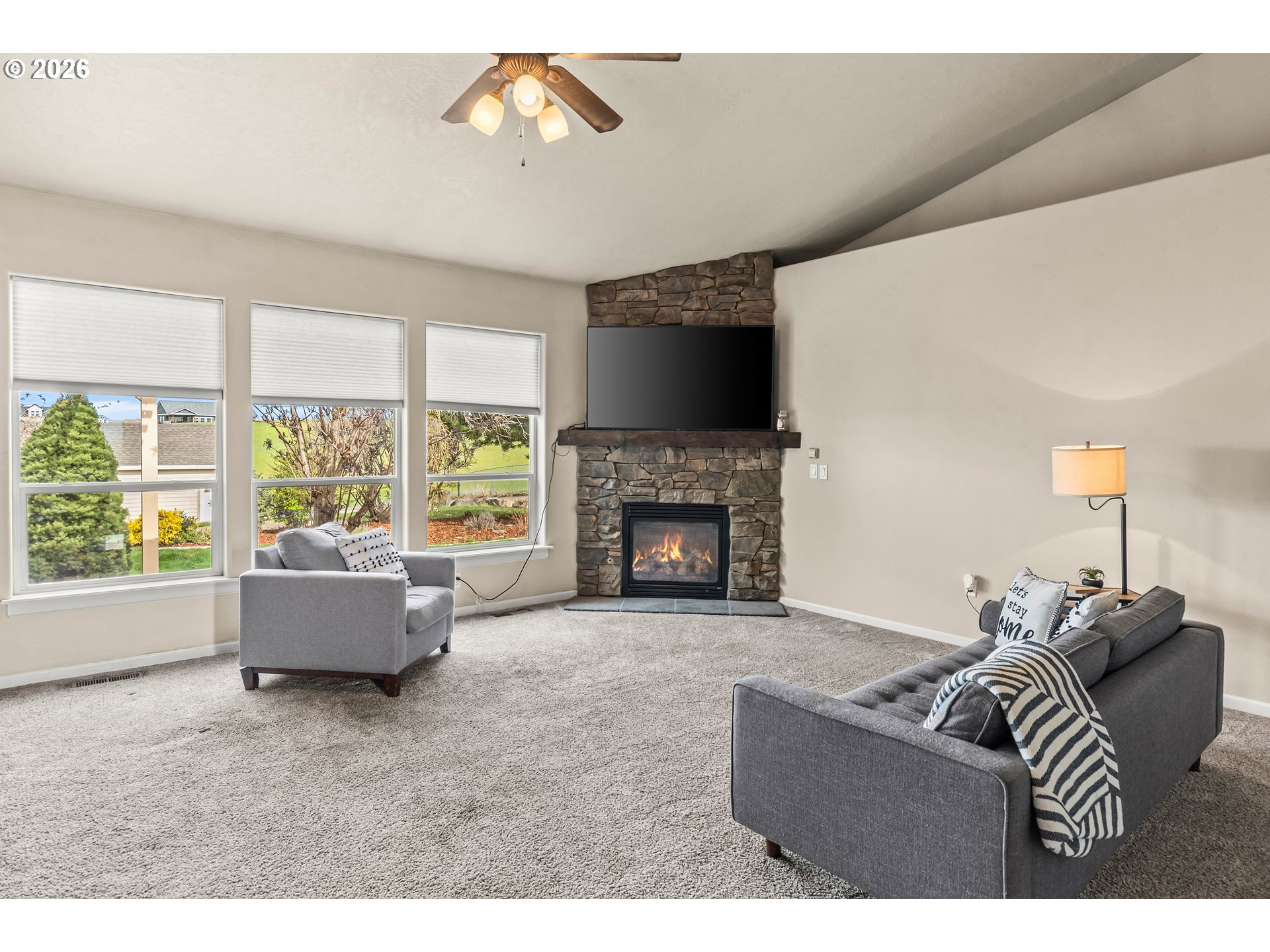 77286 Joyce Way Echo, OR 97826 - Photo 16 of 41 a living room with furniture a flat screen tv and a fireplace